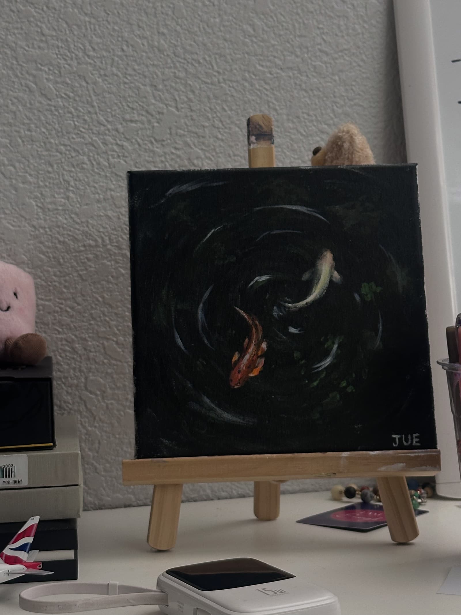 portray two goldfish swimming in a pond, inspired by an online photograph.